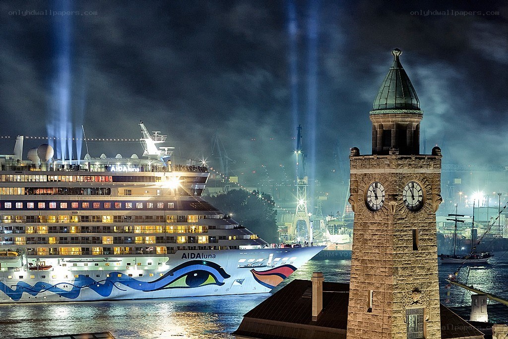 Cruise ship at night with clock tower