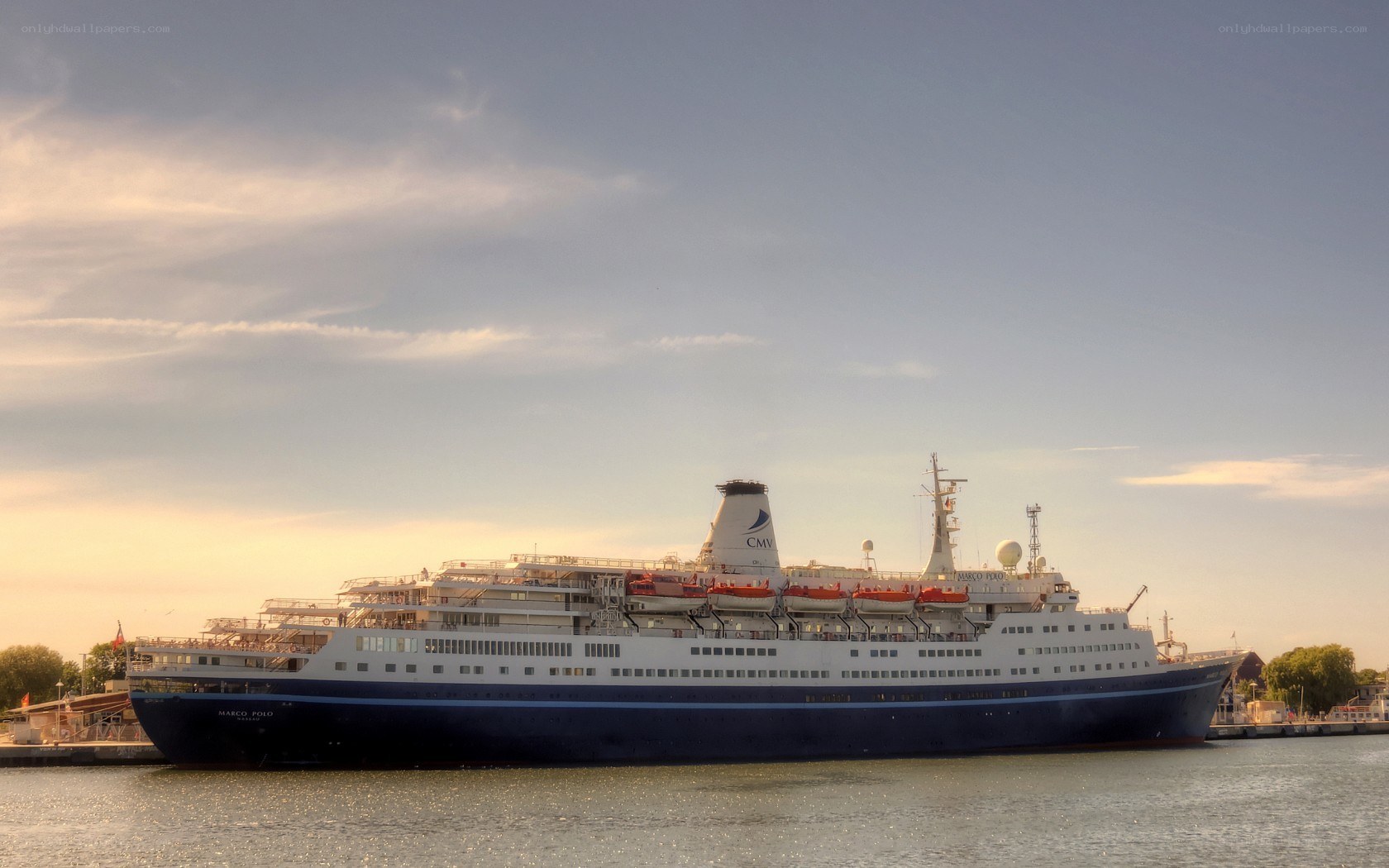 Cruise ship docked at sunset