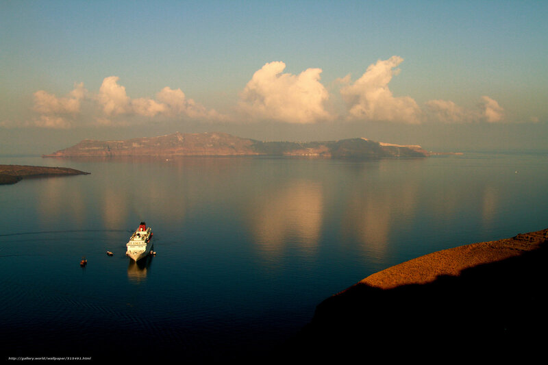 Cruise ship in caldera at sunset