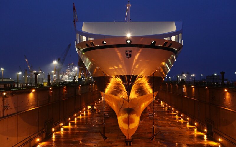 Cruise ship in dry dock at night