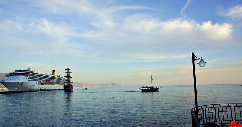 Cruise Ship in Harbor — Blue, Serene, Afternoon, Photograph, Boat, Lamp Post