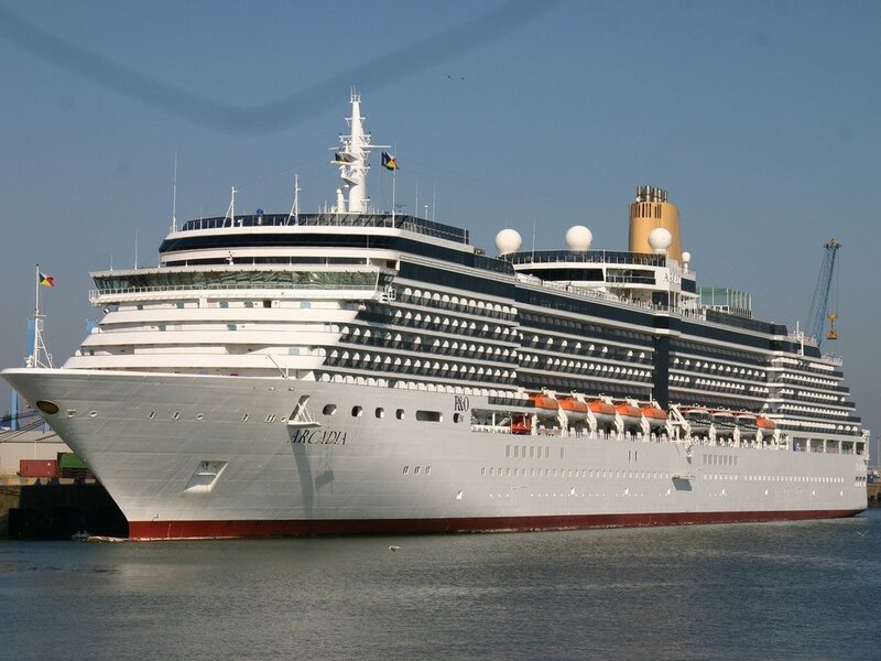 Cruise Ship in Harbor — White, Calm, Afternoon, Photograph, Flag