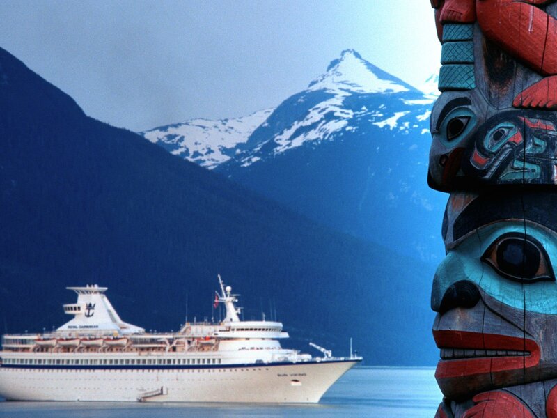 Cruise ship near totem pole