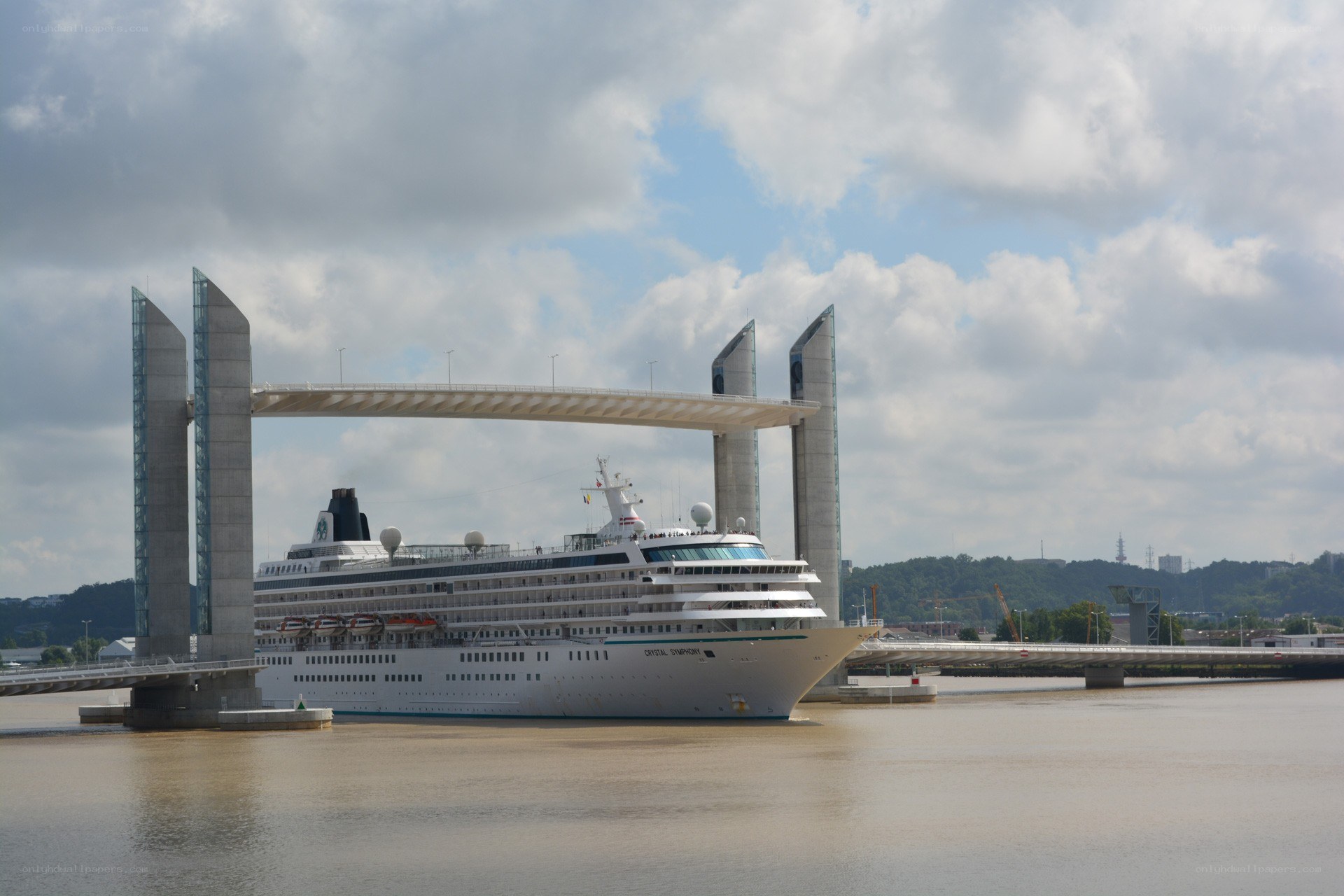 Cruise ship passing under bridge