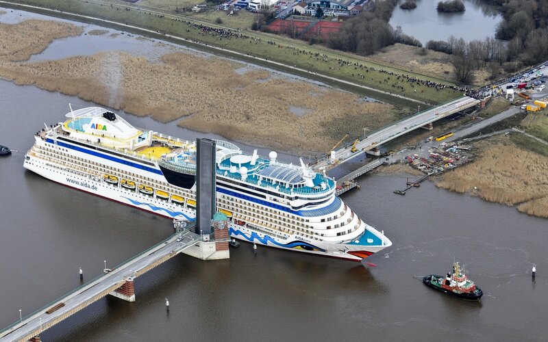 Cruise ship passing under bridge
