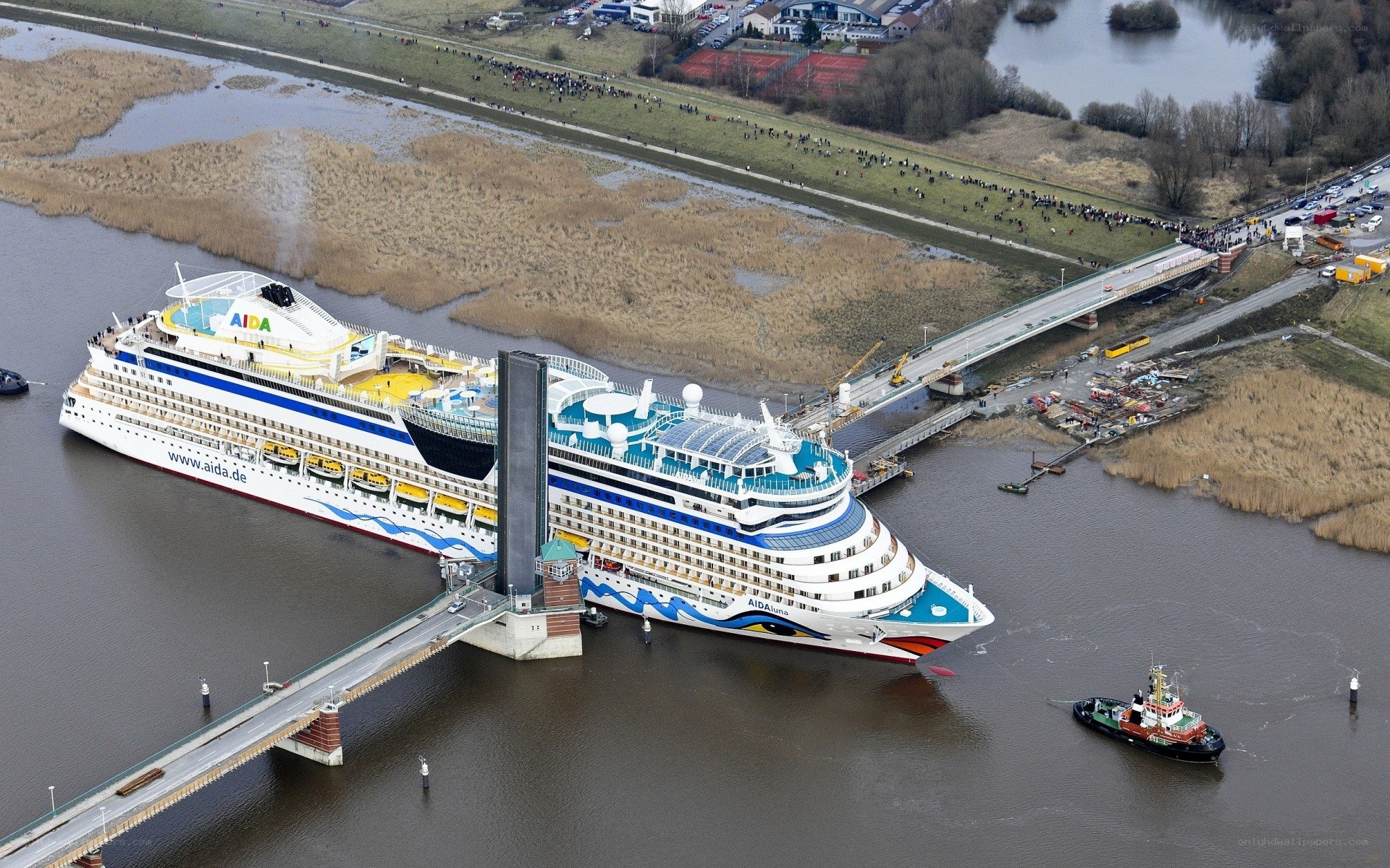Cruise ship passing under bridge