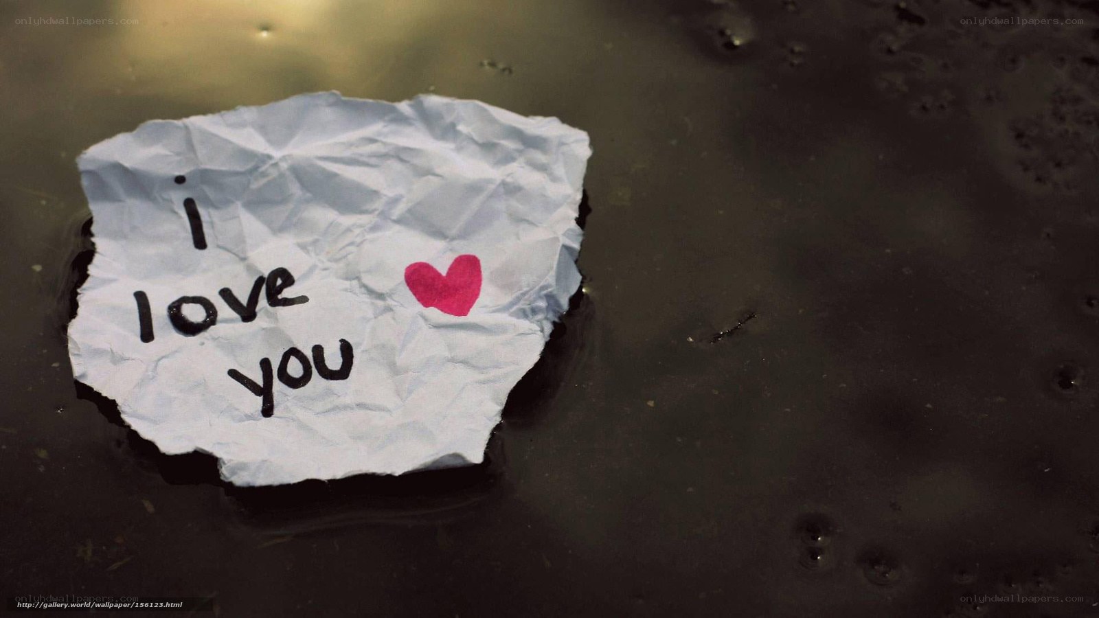 crumpled love note in water