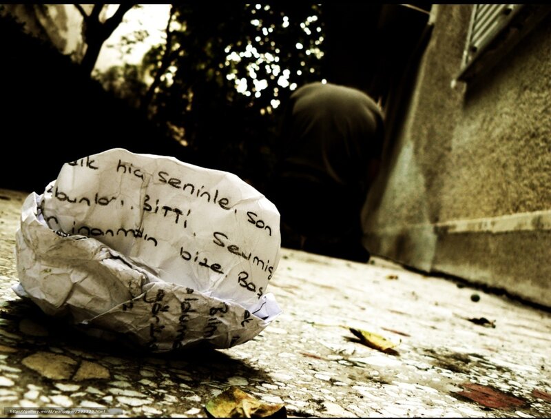 crumpled note on pavement