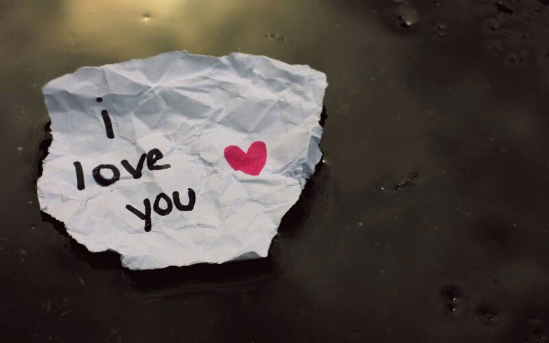 crumpled note with love message