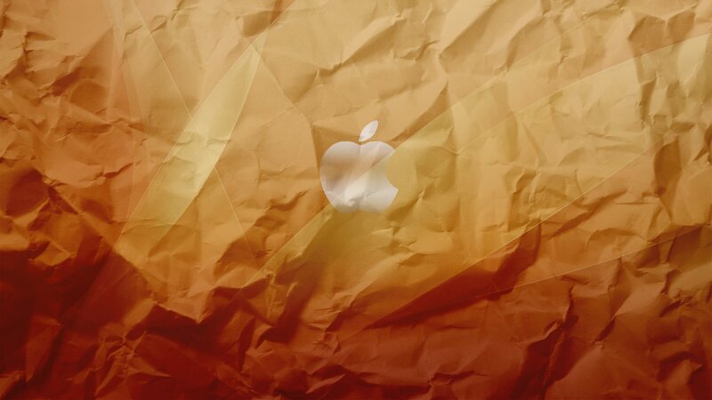crumpled paper background with apple logo