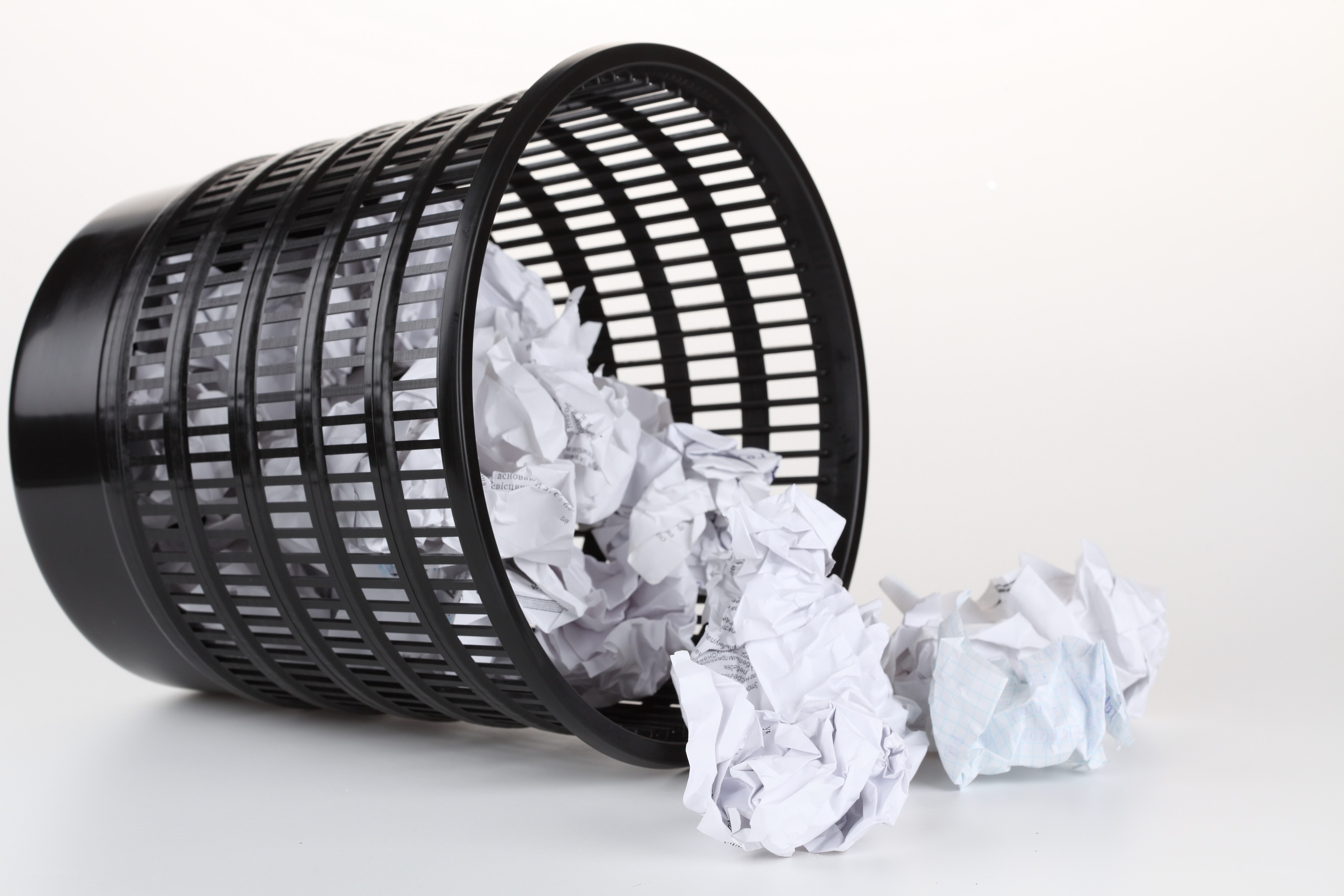 crumpled paper in trash can