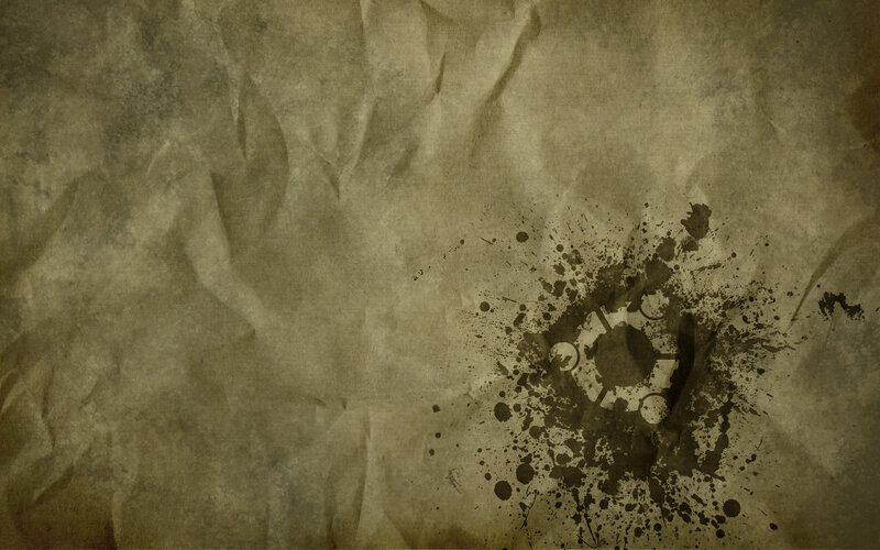 crumpled paper with ink splatter