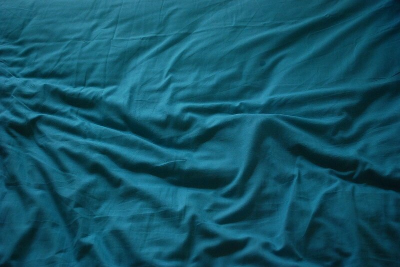crumpled teal fabric