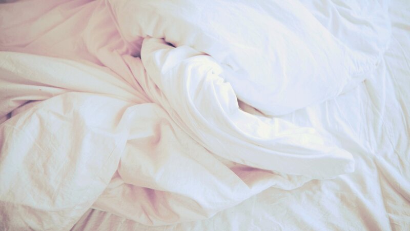 crumpled white bedding