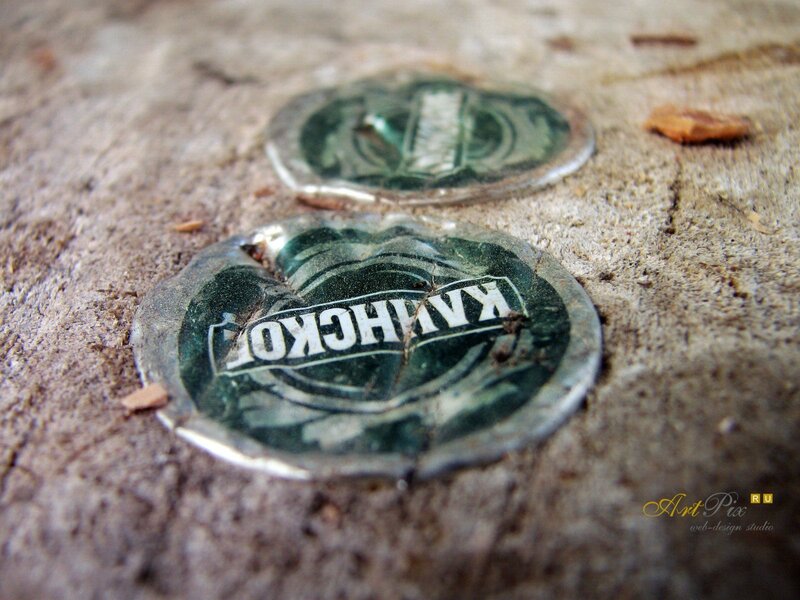 Crushed bottle caps on ground