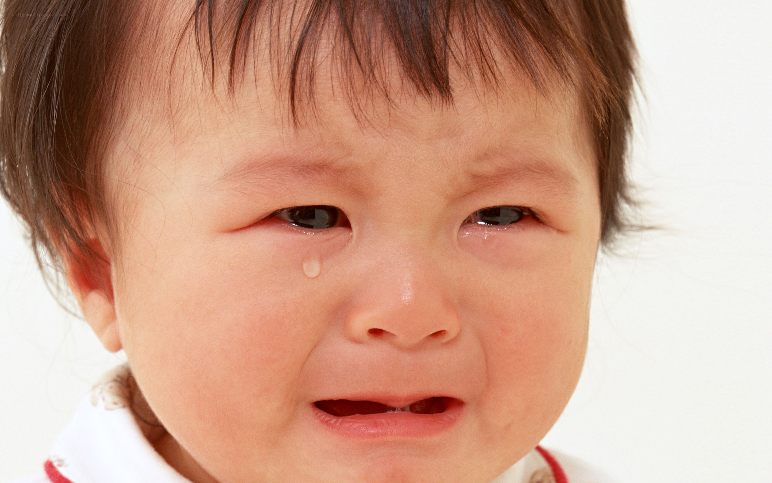 crying baby with tear