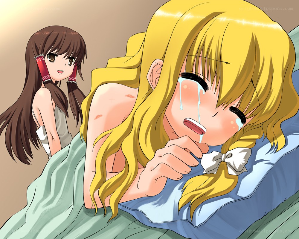 Crying blonde girl in bed