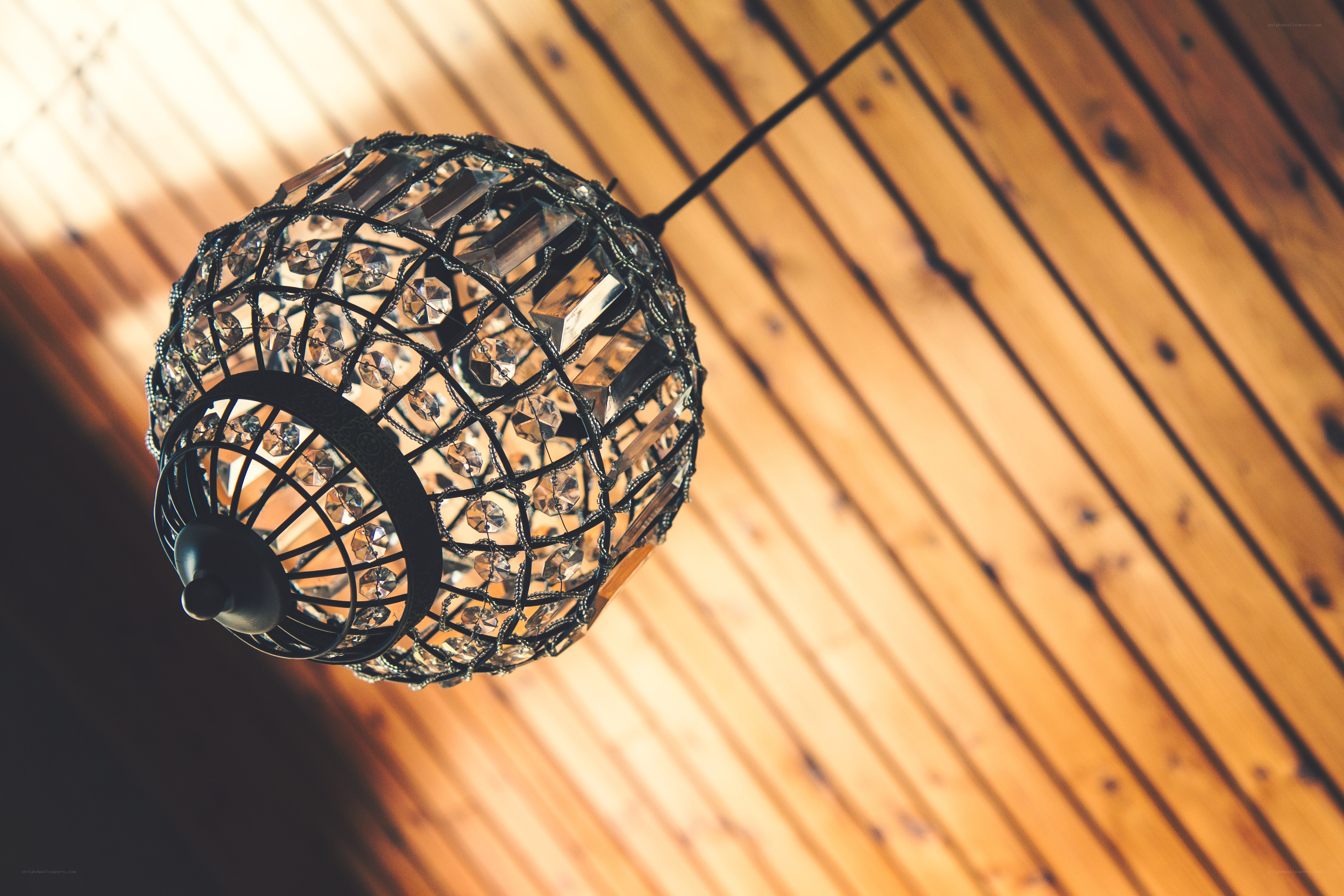 crystal chandelier on wooden ceiling