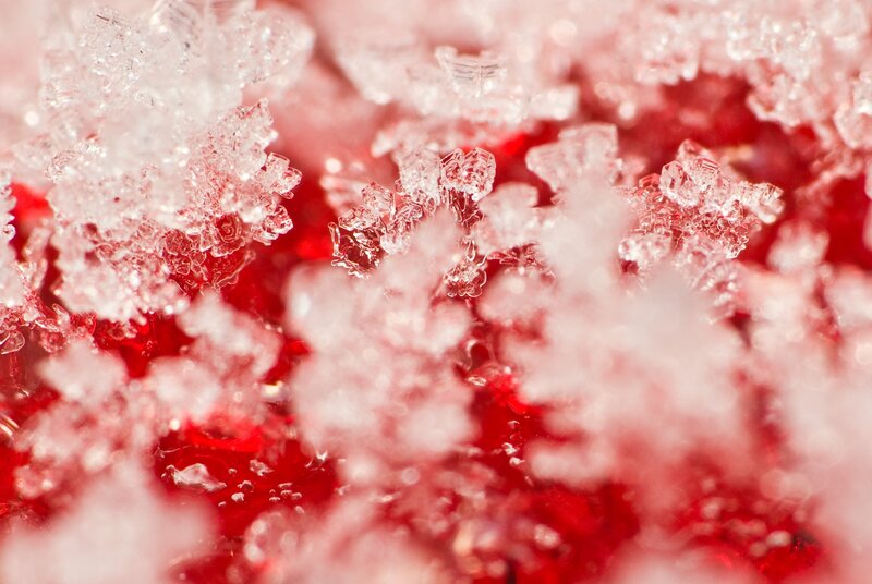 crystalline ice on red surface