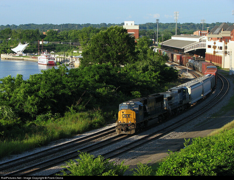 CSX train on river bend