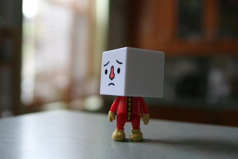 cube-headed toy figure