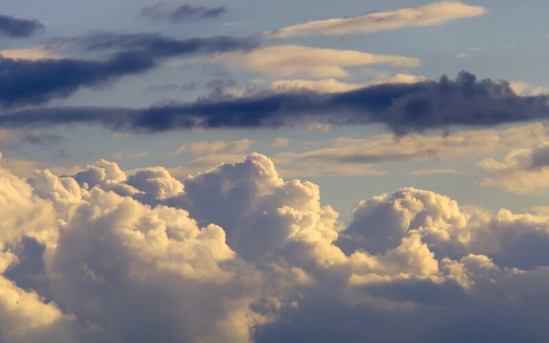 Cumulus Clouds at Sunset — White