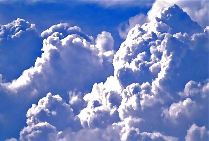 Cumulus clouds in blue sky