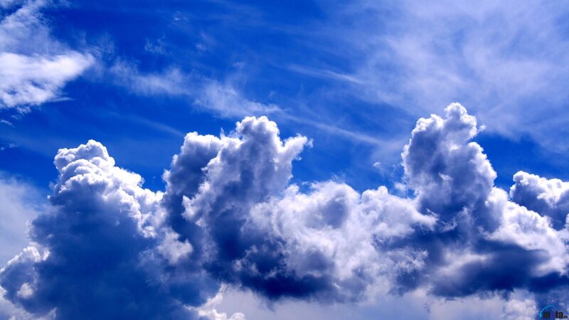 Cumulus Clouds in Blue Sky — Photograph