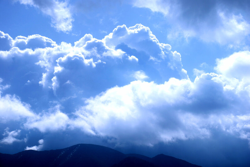 Cumulus Clouds over Mountains — Blue, Dramatic
