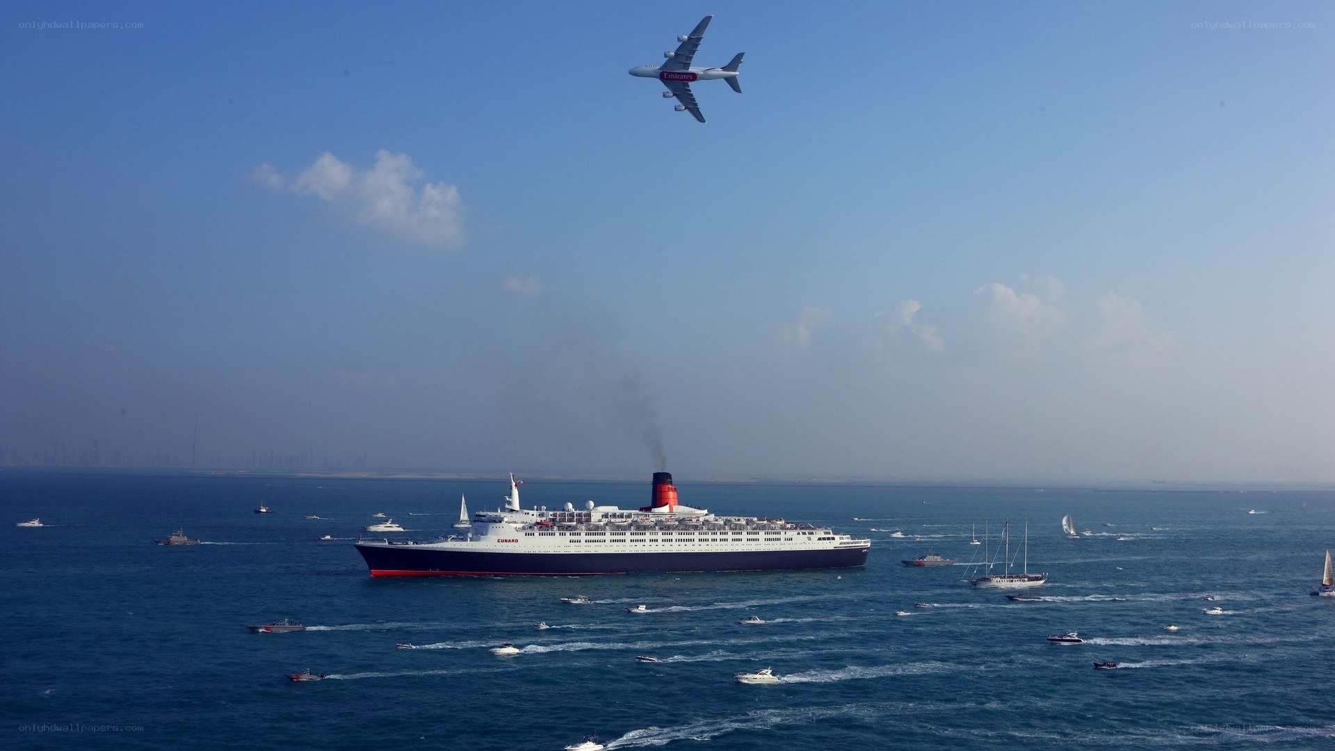 Cunard ship and Emirates plane
