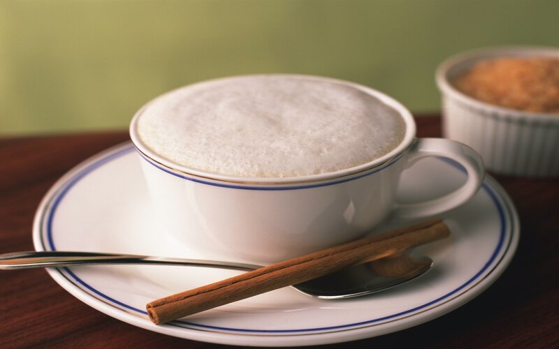 Cup of cappuccino with cinnamon