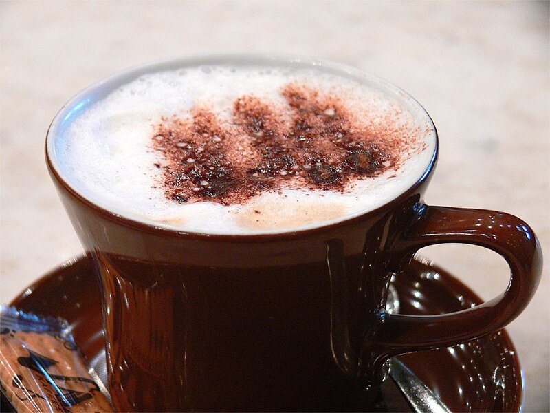 Cup of cappuccino with cocoa