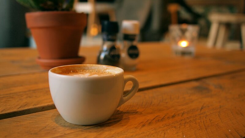 Cup of coffee on wooden table