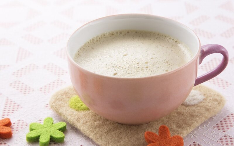 cup of frothy beverage