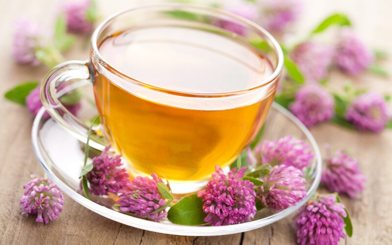 cup of herbal tea with flowers