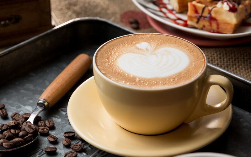 Cup of latte with heart art