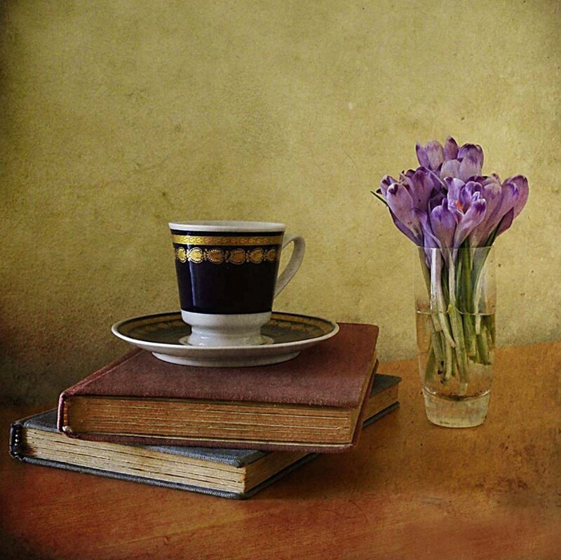 Cup on Books with Flowers