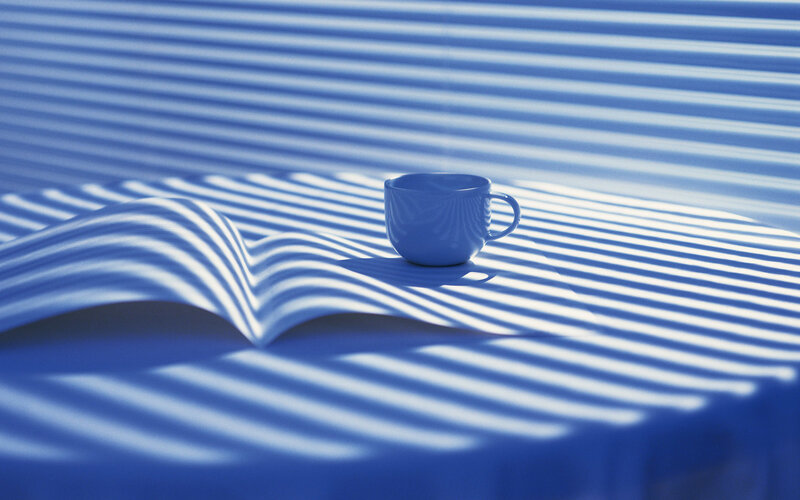Cup on striped surface