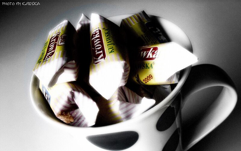 Cup with candy wrappers