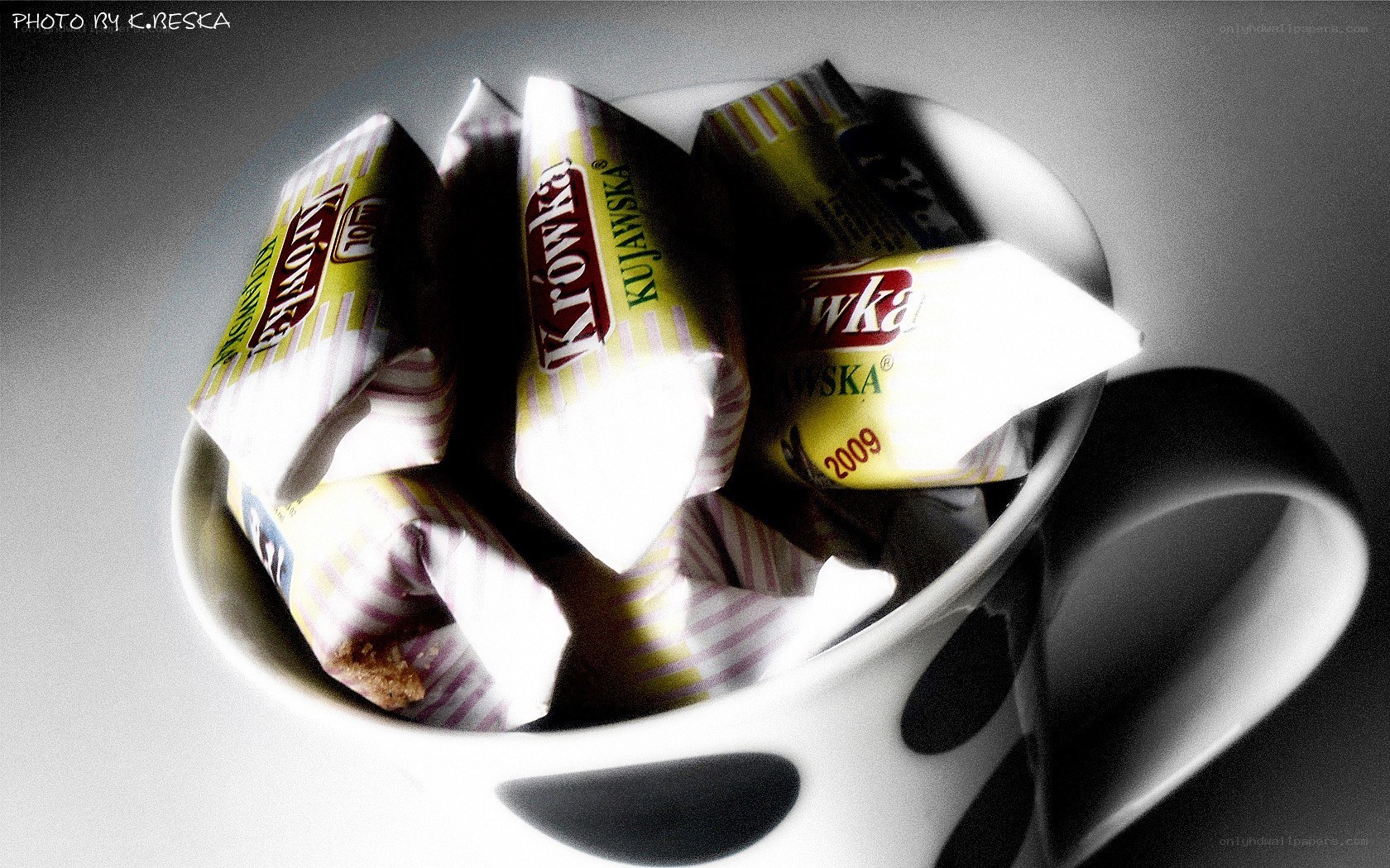 Cup with candy wrappers
