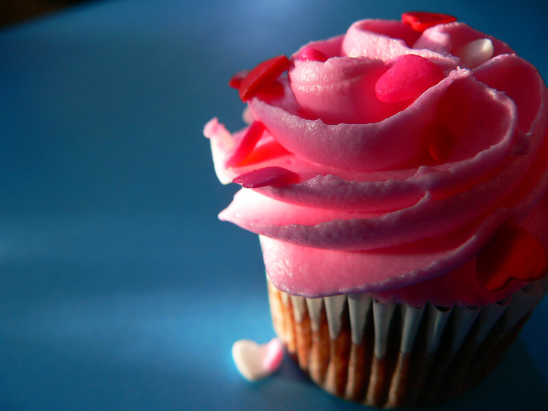 Cupcake with Pink Frosting — Dramatic, Photograph, Heart-shaped Sprinkles, Paper Liner