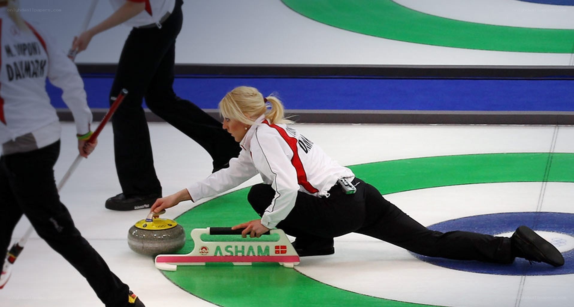 Curling athlete releasing stone