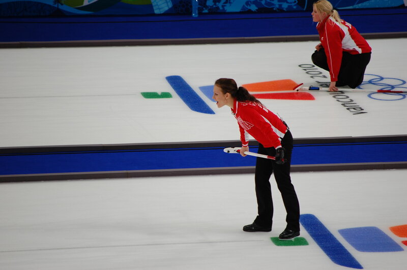 Curling athletes in action