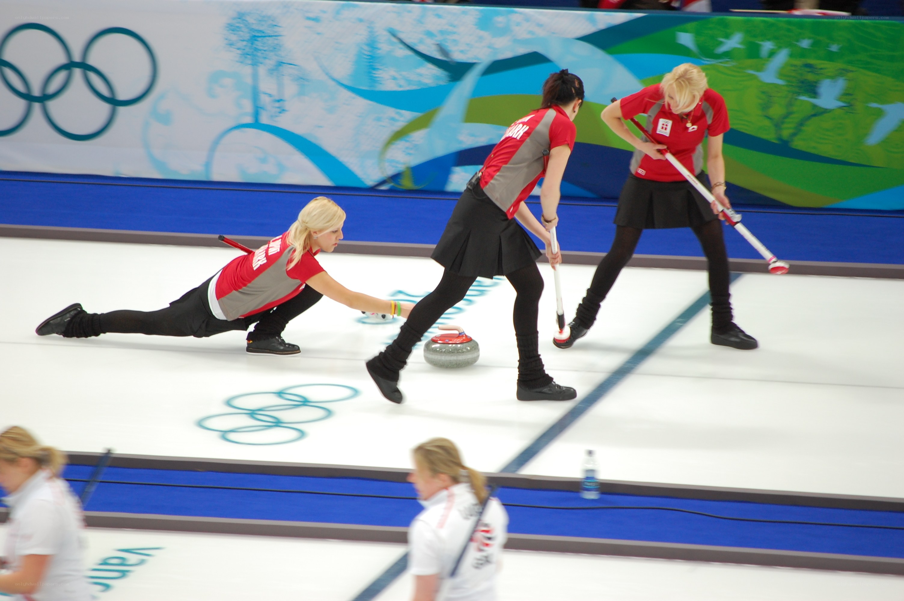 Curling athletes in action