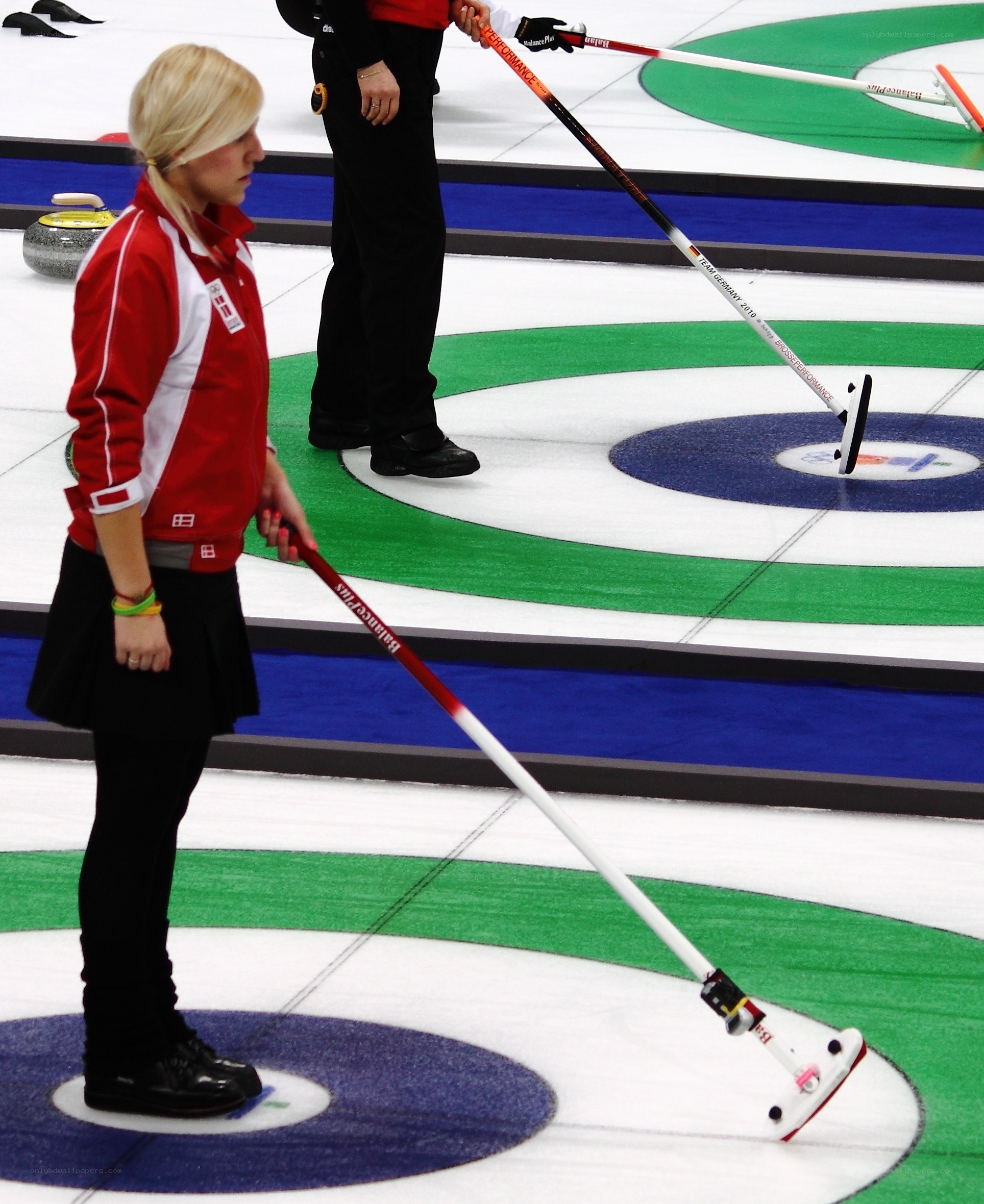 Curling athletes on the ice