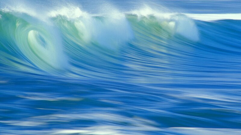 Curling ocean wave in motion