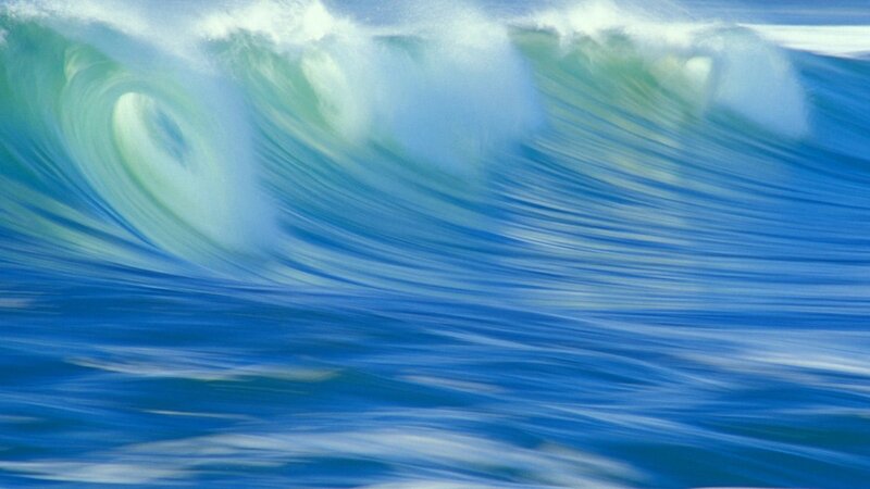 Curling ocean wave in motion