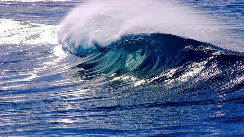 Curling ocean wave with foam