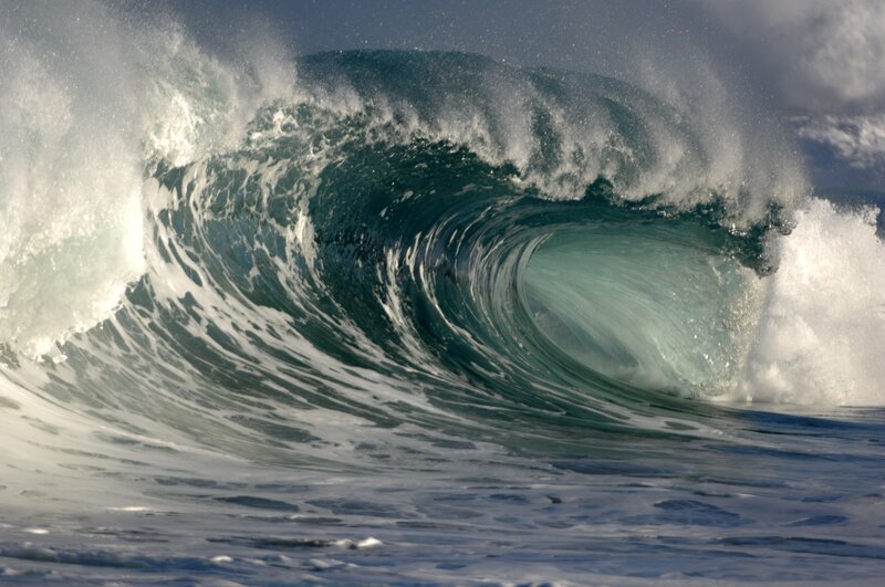 Curling ocean wave with foam