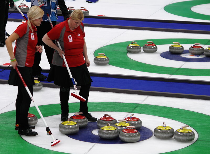 Curling players on the ice